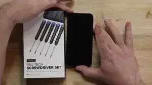 Before securing the screen, power on the device to confirm it boots up and functions correctly. If everything operates as expected, power it off again and carefully press the screen into place, ensuring all edges snap in evenly and securely.