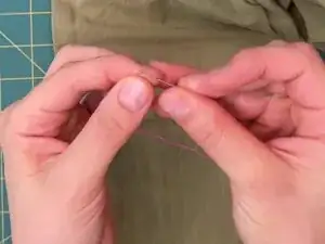 Thread the needle with about 24 inches (62 cm) of thread and tie a knot at one end. For more details, see <a href="../../home/not_yet_available?url=/Wiki/Needles_and_Thread">Needles and Thread</a>.