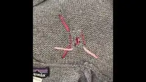 Flip the garment over to the backside.