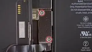 Once the screen is lifted, you’ll see several ribbon cables coming from the screen connected to the device. Focus on the ones near the center of the screen first. The first two are covered. Use a Y000 screwdriver to remove the cover, then carefully disconnect all three ribbons.