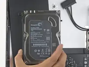 Remoção do alto-falante Intel do iMac para guias do HD