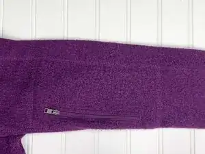 Lay your sweater flat on a clean surface. Focus on one pilled area at a time.