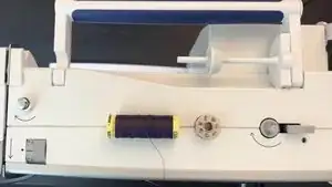 Place the bobbin onto the bobbin winder pin.