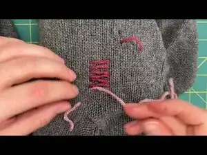 Carefully weave the needle between the existing rows of yarn.