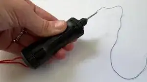 Control the thread tension (how easily the thread emerges from the ESA) by tightening or loosening the bottom cap.