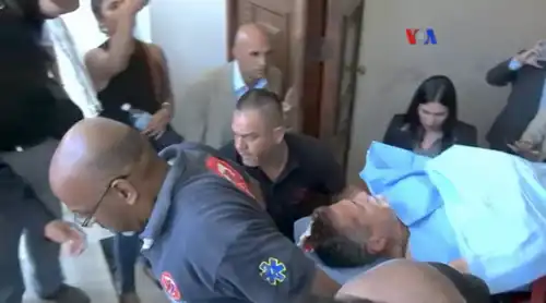 Americo De Grazia em uma maca