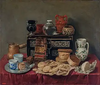 Móveis e cerâmicas Still Life with an Ebony Chest por Antonio de Pereda; c. 1652, 80 × 94&nbsp;cm, Museu Hermitage.
