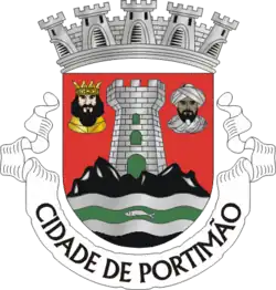 Armas do município de Portimão, Portugal (Uma cabeça de carnação branca e outra de carnação negra)