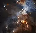 Uma sombra criada pelo disco protoplanetário que envolve a estrela HBC 672 dentro da nebulosa.[8]