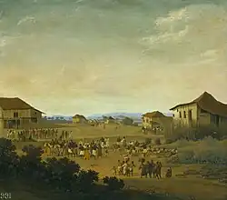 "Uma vila no Brasil", por Frans Post. Ao fundo, à esquerda, podem ser vistos indígenas usando o manto em meio a um grupo. Observa-se que os mantos utilizados pelos povos originários possuem comprimentos distintos dos exibidos em representações artísticas europeias.[8]