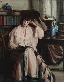 Woman reading (c. 1910)