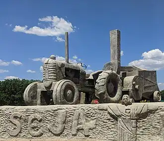 Escultura na entrada de Guzolândia