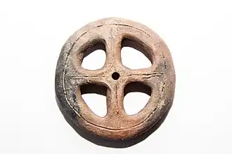 Fusaiola com raios em terracota (diâmetro 5,5cm), Holanda