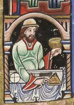 Mesa de banquete com toalha, pão, faca e tarte(?). ~1170. Saltério Hunteriano