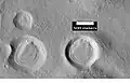 Camadas em crateras, vistas pela HiRISE sob o programa HiWish. Essa área foi provavelmente coberta por estas camadas, as camadas já foram erodidas exceto no interior protegido das crateras.
