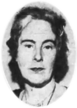 A black and white photograph of a woman's head