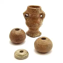 Três fusaiolas da Idade Média