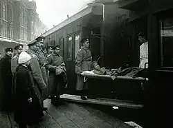 Evacuation of a wounded man by rail, Moscow, 1914.