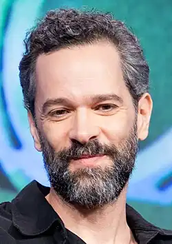 Neil Druckmann smirking
