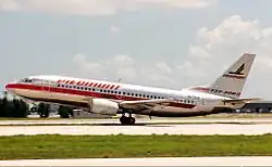 Aircraft takeoff, twinjet airliner tilted as it leaves the runway