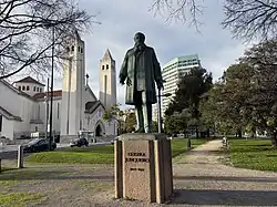 Jardim da Praça de Londres, Lisboa, Portugal. Estatua de Guerra Junqueiro, Igreja Sao Joao de Deus, Edificio do Ministério do Trabalho.