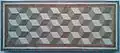 Um mosaico geométrico romano antigo. A textura cúbica induz uma ilusão de ótica do tipo cubo de Necker.