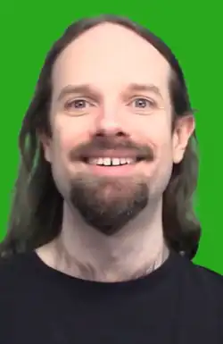 Ross Scott in front of a green screen