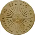 Reverso da primeira moeda argentina com o sol de maio, 1813 (redesenho de 1991)