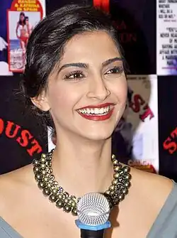 A shot of Sonam Kapoor, laughing away from the camera