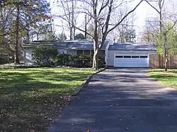 Treys childhood home in Princeton, New Jersey. A ranch style house and driveway.