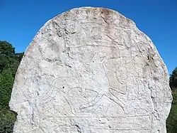 Homem morto sendo recebido por uma valquíria no além Desenho feito na pedra