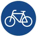 rundes Schild mit weißem Fahrrad auf blauem Grund