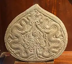 Bodhi tree leaf with dragon carving, a common decorative theme of Ly dynasty