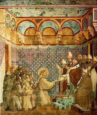 Afresco do século XIV de Giotto di Bondone na Basílica de Assis retratando o encontro de Francisco e Inocêncio, nele, Inocêncio usa o vestuário típico de sua época.