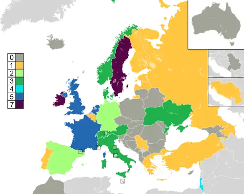 Mapa dos países da Europa, Norte da África e Ásia Ocidental, com inserções de Austrália e Jugoslávia no canto superior direito, coloridos para indicar seu recorde de vitórias: os países sem vitórias são coloridos em cinza escuro; os outros países são coloridos da seguinte forma: 1 vitória em amarelo, 2 vitórias em verde claro, 3 vitórias em verde neon; 4 vitórias em azul-petróleo; 5 vitórias em azul; 6 vitórias em roxo; 7 vitórias em roxo escuro