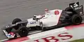 Kamui Kobayashi pilotando a Sauber C31 no Grande Prêmio da Malásia de 2012.
