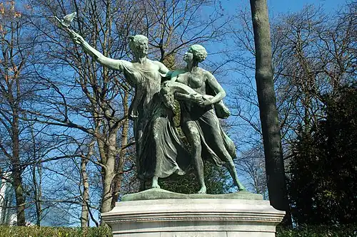 «&nbsp;O génio belga que guia o Congo&nbsp;»(Monument General Thys, Cinquentenário, Bruxelas).