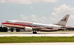 Aircraft takeoff, twinjet airliner tilted as it leaves the runway