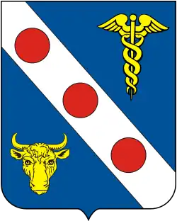 Em campo azul, uma banda de prata com três arruelas de gules, acompanhada á sinistra de um caduceu de ouro, e á destra de um encontro de boi, do mesmo.
